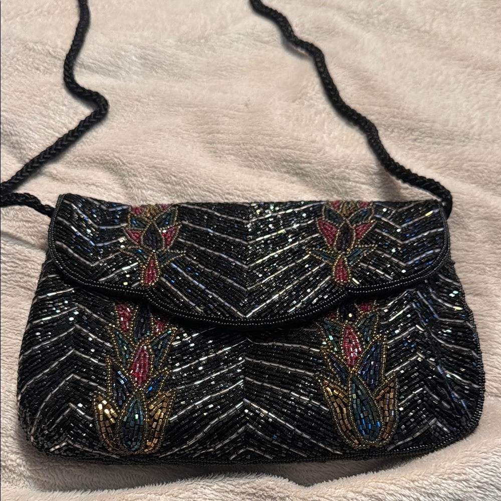 Black Decorative Clutch withBeaded Pattern. 1st picture is in bright light.
